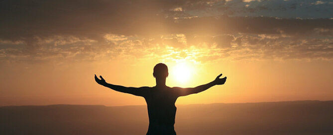 person looking at sunrise